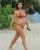 4. Kim Kardashian pamer baby bump menggunakan bikini pantai