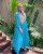 4. Jangan takut padukan warna, Nycta Gina padukan hijab segi empat warna abu gaun biru terang